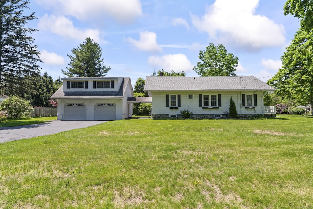 18 Glover Ave, Newtown, CT 06470 - view of front facade with asphalt driveway