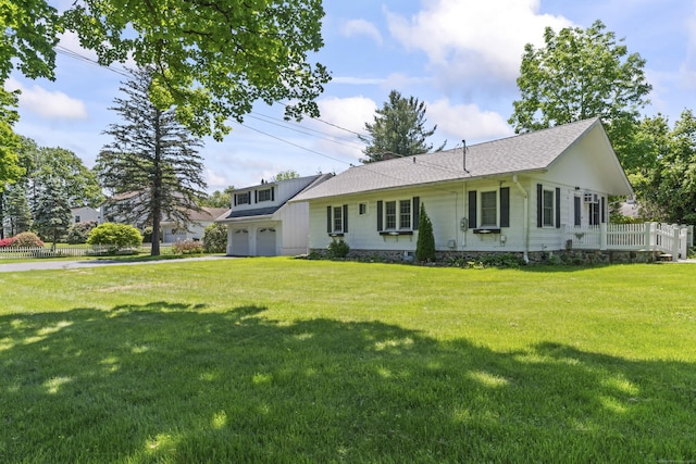 18 Glover Ave, Newtown, CT 06470 - view of front facade featuring driveway, a front lawn, and a shingled roof