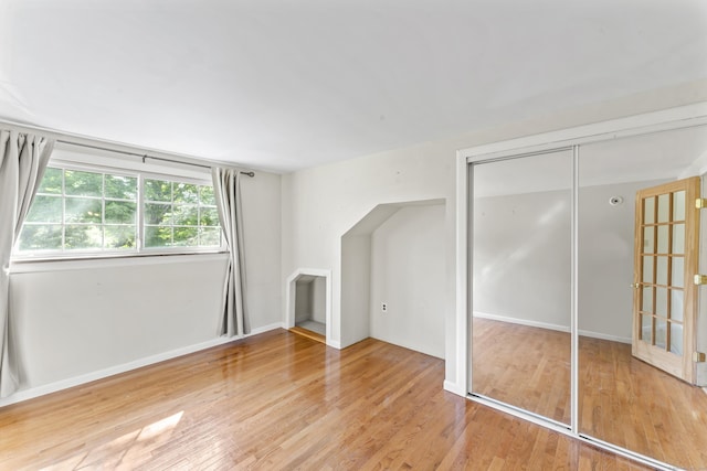 18 Glover Ave, Newtown, CT 06470 - unfurnished living room featuring wood finished floors and baseboards