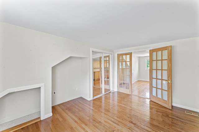 18 Glover Ave, Newtown, CT 06470 - spare room featuring wood finished floors and french doors