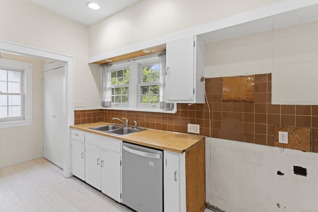 18 Glover Ave, Newtown, CT 06470 - kitchen with dishwasher, decorative backsplash, white cabinets, and light countertops