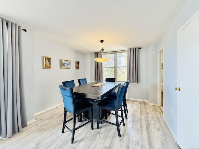 1 Strawberry Hill Ct Apt 1A, Stamford, CT 06902 - dining area featuring light wood-style flooring and baseboards