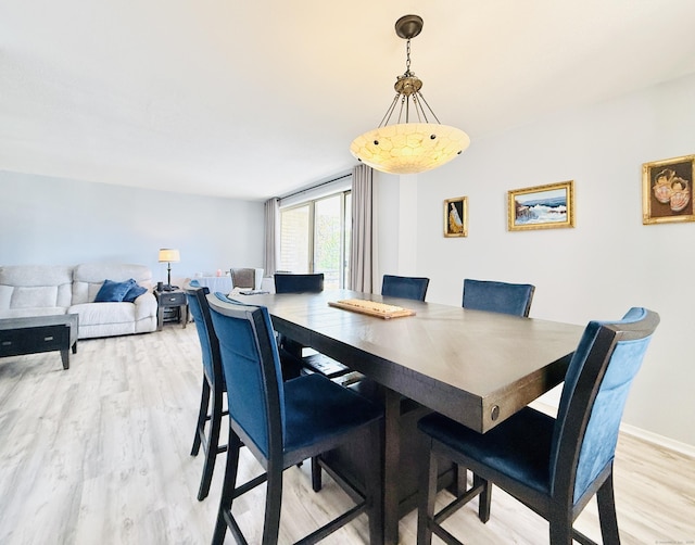 1 Strawberry Hill Ct Apt 1A, Stamford, CT 06902 - dining area with light wood-style flooring and baseboards