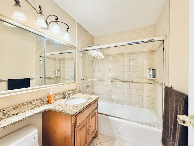 1 Strawberry Hill Ct Apt 1A, Stamford, CT 06902 - full bathroom with toilet, vanity, tile patterned floors, and combined bath / shower with glass door