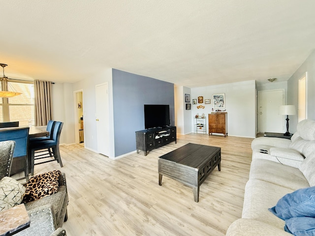 1 Strawberry Hill Ct Apt 1A, Stamford, CT 06902 - living area with light wood-style flooring and baseboards