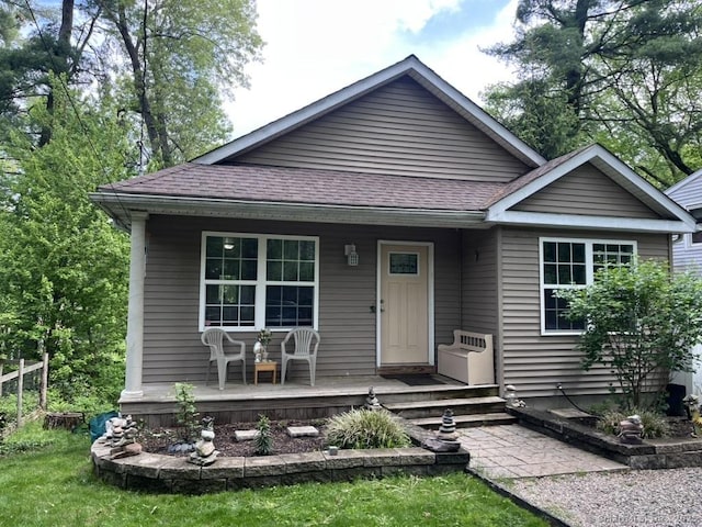 6 Pine Dr, Farmington, CT 06085 - view of front facade with a porch and roof with shingles