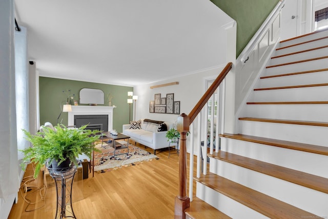 10 Knollwood Rd, Farmington, CT 06032 - living area with a fireplace, wood finished floors, and stairway