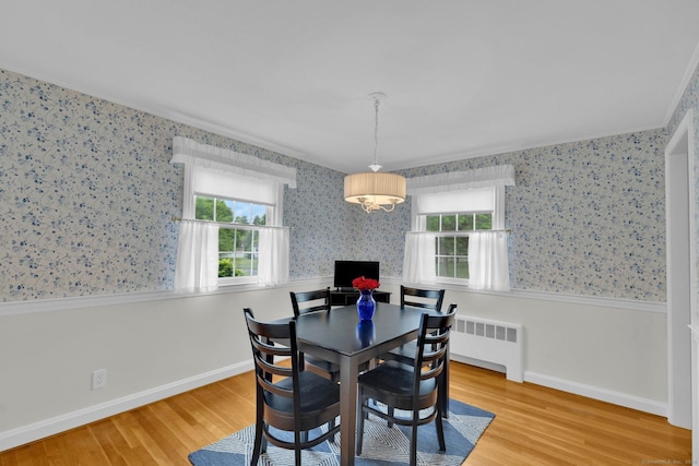 10 Knollwood Rd, Farmington, CT 06032 - dining space featuring radiator, wood finished floors, wallpapered walls, baseboards, and crown molding