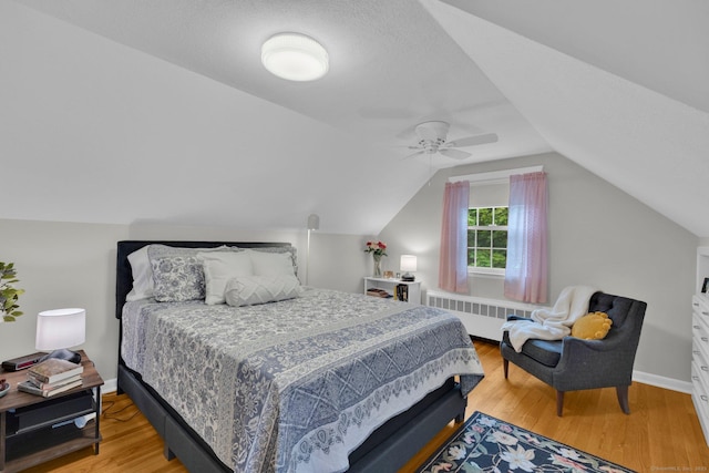 10 Knollwood Rd, Farmington, CT 06032 - bedroom with radiator, light wood-style flooring, lofted ceiling, baseboards, and a ceiling fan