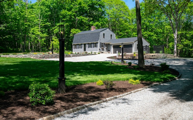 586 Essex Rd, Westbrook, CT 06498 - dutch colonial featuring a gambrel roof, driveway, an attached garage, a shingled roof, and a front lawn