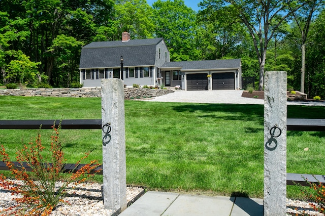 586 Essex Rd, Westbrook, CT 06498 - colonial inspired home with a gambrel roof, roof with shingles, a garage, a front yard, and a chimney