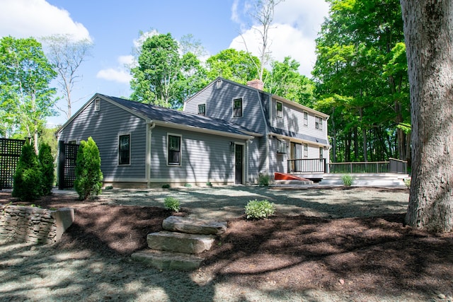 586 Essex Rd, Westbrook, CT 06498 - view of front of home featuring a wooden deck and a chimney