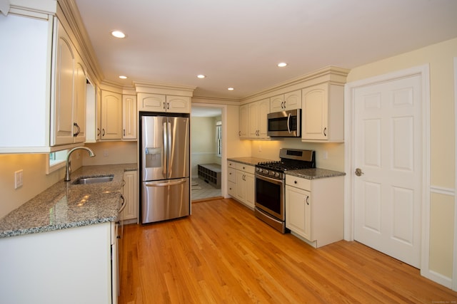 586 Essex Rd, Westbrook, CT 06498 - kitchen featuring stainless steel appliances, a sink, light wood-style floors, stone countertops, and recessed lighting