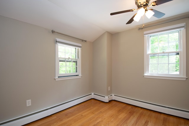 586 Essex Rd, Westbrook, CT 06498 - empty room with plenty of natural light, light wood-style floors, baseboard heating, and vaulted ceiling