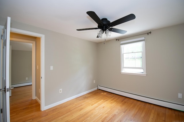 586 Essex Rd, Westbrook, CT 06498 - empty room featuring baseboard heating, light wood-style floors, ceiling fan, and baseboards