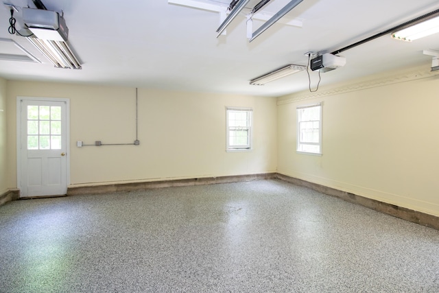 586 Essex Rd, Westbrook, CT 06498 - garage featuring a garage door opener and baseboards