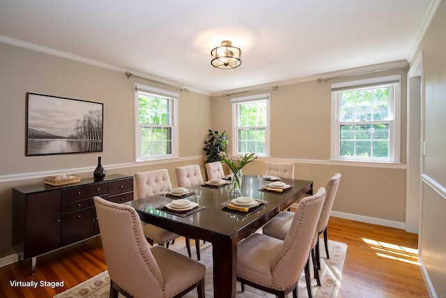 586 Essex Rd, Westbrook, CT 06498 - dining area featuring wood finished floors, ornamental molding, and baseboards