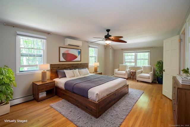 586 Essex Rd, Westbrook, CT 06498 - bedroom with a wall unit AC, a baseboard radiator, light wood-style floors, and ceiling fan