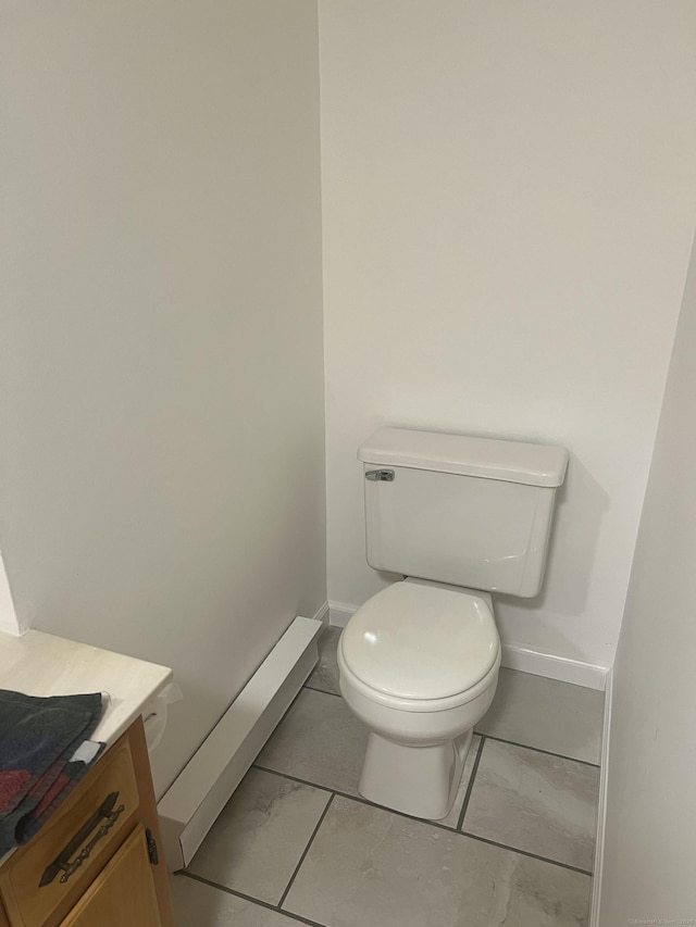 433 Garden St, Hartford, CT 06112 - bathroom with baseboards, marble look tile flooring, and toilet