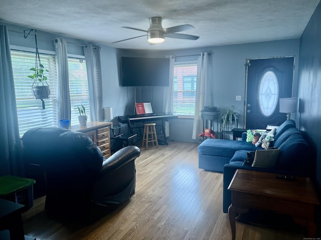 433 Garden St, Hartford, CT 06112 - living room featuring a textured ceiling, a ceiling fan, and wood finished floors