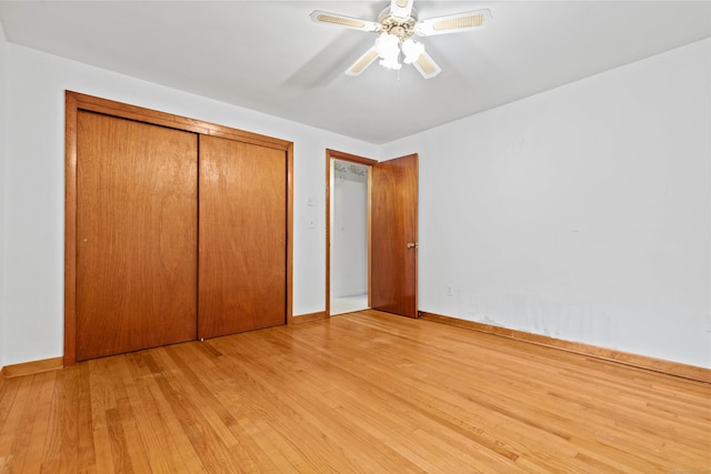 654 Beach Pond Rd, Voluntown, CT 06384 - unfurnished bedroom featuring light wood-style flooring, a closet, baseboards, and a ceiling fan