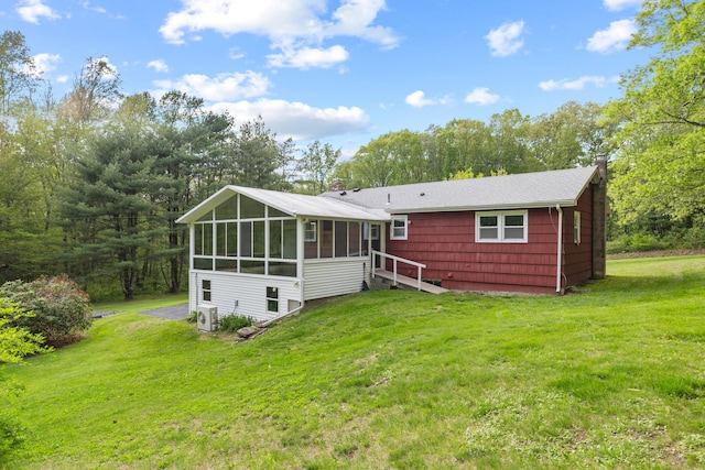 654 Beach Pond Rd, Voluntown, CT 06384 - back of property with a sunroom, a lawn, and ac unit