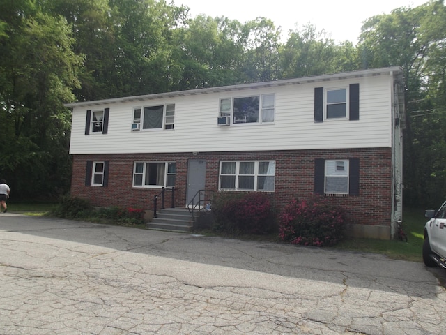 1211 Gold Star Hwy Unit 1211, Groton, CT 06340 - view of front facade with brick siding and cooling unit