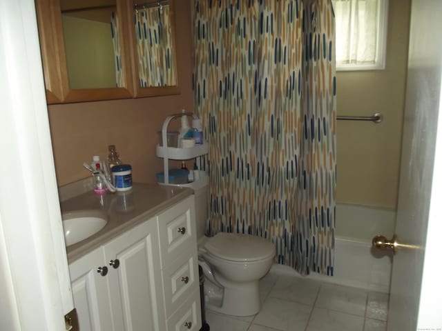 1211 Gold Star Hwy Unit 1211, Groton, CT 06340 - bathroom featuring tile patterned floors, toilet, vanity, and shower / bath combo with shower curtain