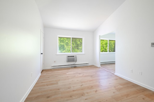 4 Farview Ave Unit 1-10, Danbury, CT 06810 - spare room with a baseboard radiator, light wood-style flooring, a wall mounted air conditioner, and baseboards