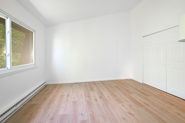 4 Farview Ave Unit 1-10, Danbury, CT 06810 - unfurnished bedroom with a baseboard radiator, light wood-style floors, a closet, and baseboards
