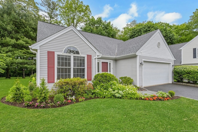 44 Village Ct Unit 44, Wilton, CT 06897 - view of front facade with roof with shingles, a garage, and a front lawn