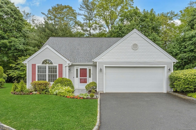 44 Village Ct Unit 44, Wilton, CT 06897 - view of front of house featuring asphalt driveway, a garage, a front yard, and roof with shingles