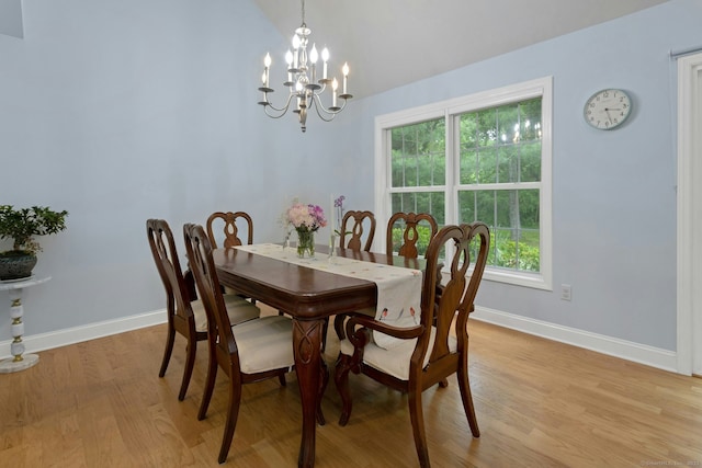 44 Village Ct Unit 44, Wilton, CT 06897 - dining area with light wood finished floors, a chandelier, baseboards, plenty of natural light, and lofted ceiling