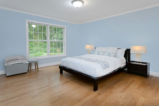 44 Village Ct Unit 44, Wilton, CT 06897 - bedroom featuring baseboards, crown molding, and light wood-type flooring