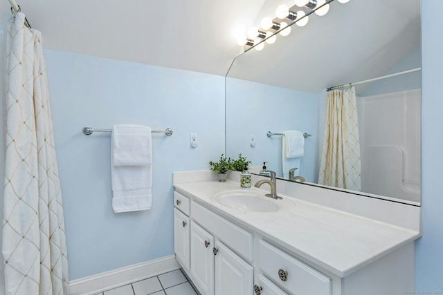 44 Village Ct Unit 44, Wilton, CT 06897 - bathroom with vanity, tile patterned flooring, vaulted ceiling, a shower with curtain, and baseboards