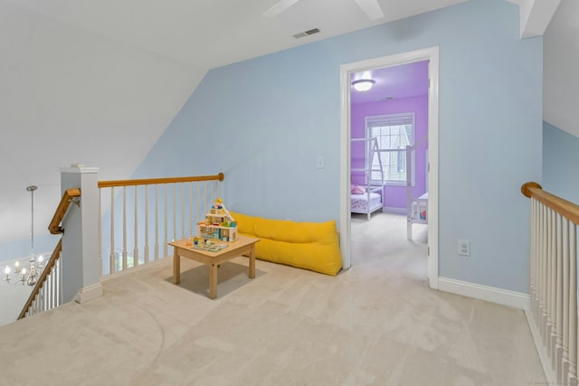 44 Village Ct Unit 44, Wilton, CT 06897 - sitting room with an upstairs landing, carpet, ceiling fan, a chandelier, and baseboards