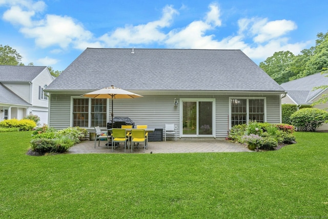 44 Village Ct Unit 44, Wilton, CT 06897 - back of property featuring a patio, a yard, and roof with shingles