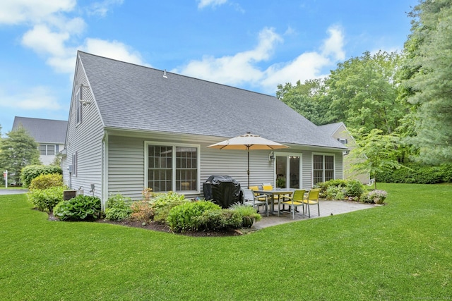44 Village Ct Unit 44, Wilton, CT 06897 - back of house with roof with shingles, a patio area, and a lawn