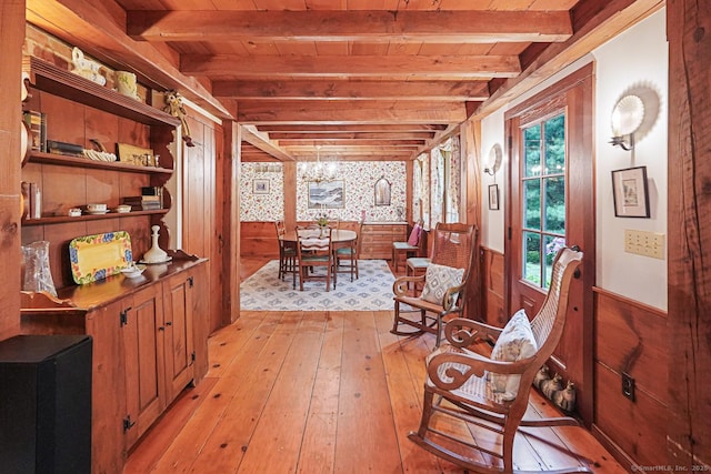 9 Pheasant Ln, Brooklyn, CT 06234 - living area featuring wood walls, light wood finished floors, a wainscoted wall, and wooden ceiling with exposed beams