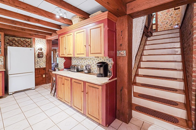 9 Pheasant Ln, Brooklyn, CT 06234 - kitchen with freestanding refrigerator, beam ceiling, light tile patterned flooring, and light stone countertops