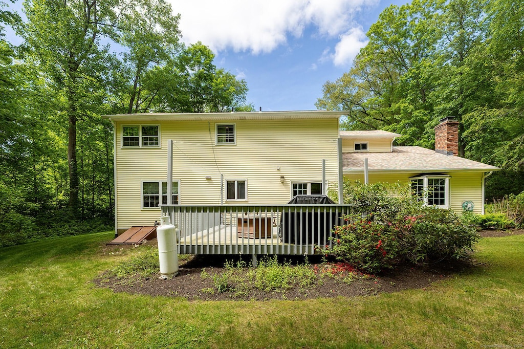 9 Meadowbrook Rd, New Fairfield, CT 06812 - back of property featuring a yard, a chimney, and a wooden deck