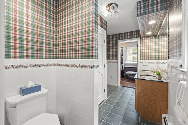 9 Meadowbrook Rd, New Fairfield, CT 06812 - half bath featuring wallpapered walls, vanity, toilet, tile patterned flooring, and baseboard heating