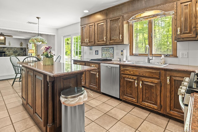 9 Meadowbrook Rd, New Fairfield, CT 06812 - kitchen featuring stainless steel appliances, a sink, light tile patterned floors, hanging light fixtures, and a center island