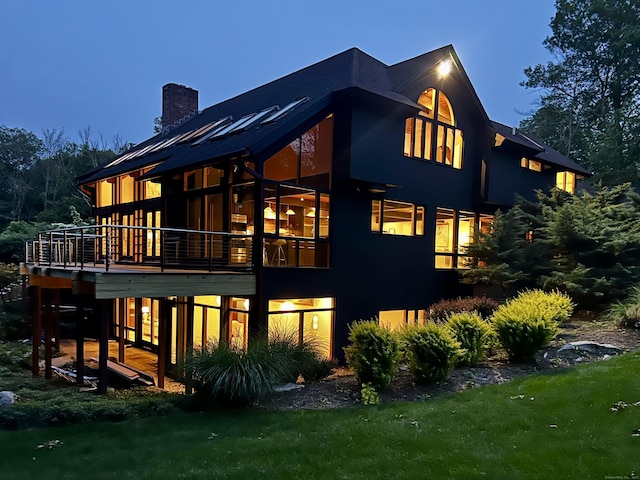 93 Graenest Ridge Rd, Wilton, CT 06897 - back of property with a chimney and a deck