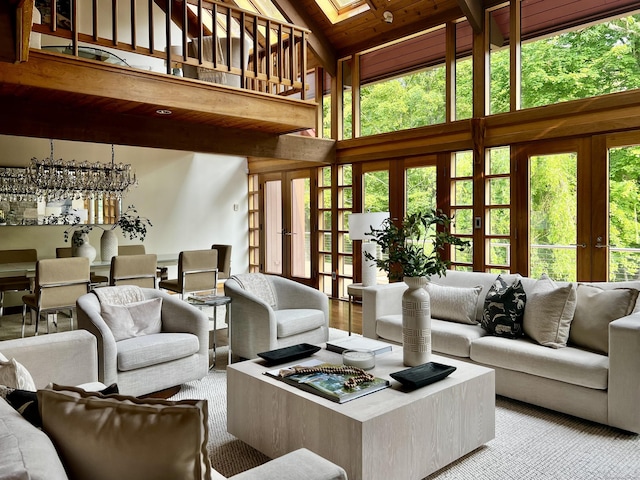 93 Graenest Ridge Rd, Wilton, CT 06897 - living room featuring french doors, high vaulted ceiling, a skylight, and wooden ceiling
