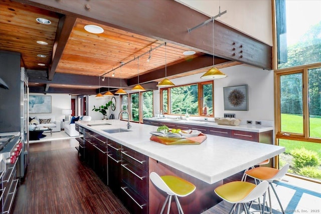 93 Graenest Ridge Rd, Wilton, CT 06897 - kitchen featuring wooden ceiling, a sink, track lighting, a large island, and light countertops