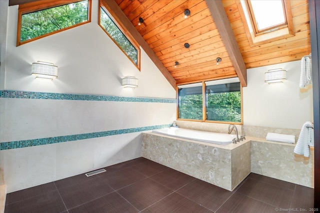 93 Graenest Ridge Rd, Wilton, CT 06897 - bathroom with a skylight, a bath, wooden ceiling, and tile patterned flooring