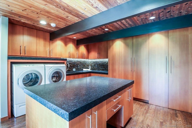 93 Graenest Ridge Rd, Wilton, CT 06897 - kitchen with washer and clothes dryer, a sink, decorative backsplash, light wood finished floors, and wood ceiling with exposed beams