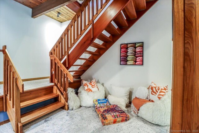 93 Graenest Ridge Rd, Wilton, CT 06897 - stairway featuring carpet flooring, baseboards, and wooden ceiling with exposed beams