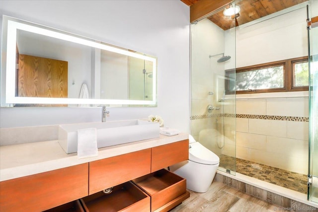 93 Graenest Ridge Rd, Wilton, CT 06897 - bathroom featuring a shower stall, toilet, vanity, and wood finished floors